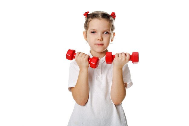 Photo girl with dumbbells