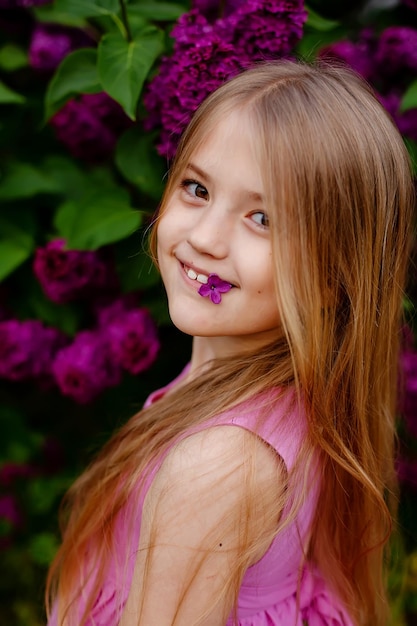 A girl with a flower in her mouth