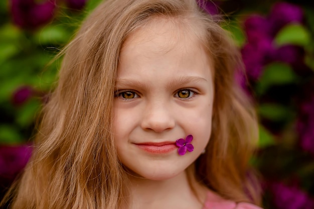 A girl with a flower on her nose