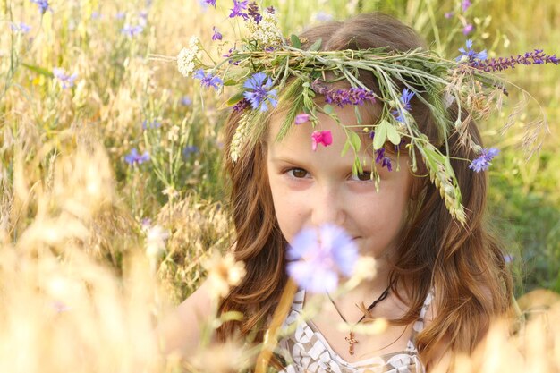 Girl with flowers diadem on her head