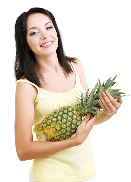 Girl with fresh pineapple isolated on white