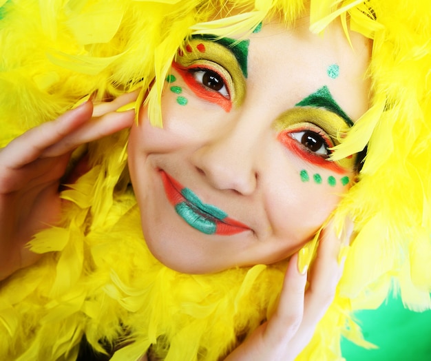 Girl with funny make up and feathers