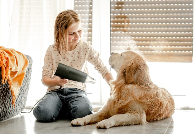 Girl with golden retriever dog