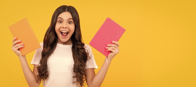 Girl with grammar book bookish kid in book store student ready\
for studying childrens literature portrait of schoolgirl student\
studio banner header school child face copyspace