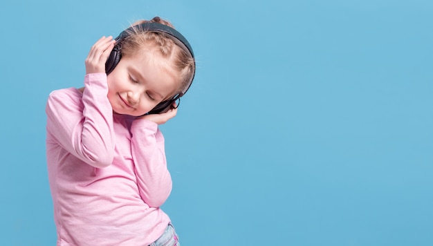 Girl with headphones listening to music