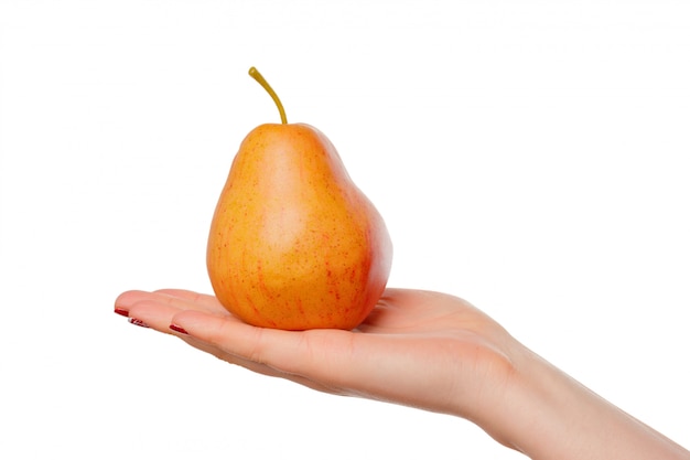 Girl with juicy pear. Young woman with fruit in her hands