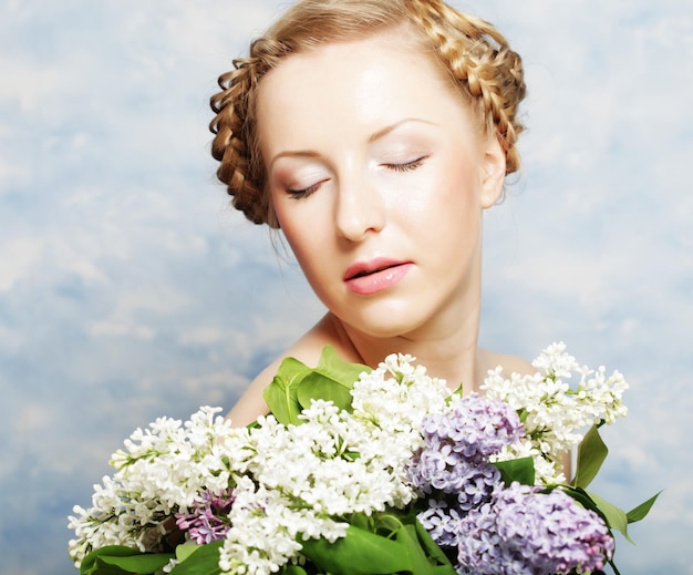 Girl with lilac flowers