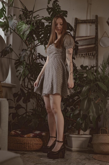 Girl with long hair on the background of foliage