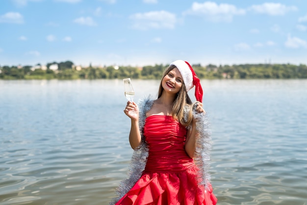 Girl with long hair holding glass of champagne