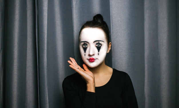 The girl with makeup of the mime. improvisation.