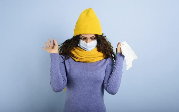 Girl with mask caught a cold. Violet background