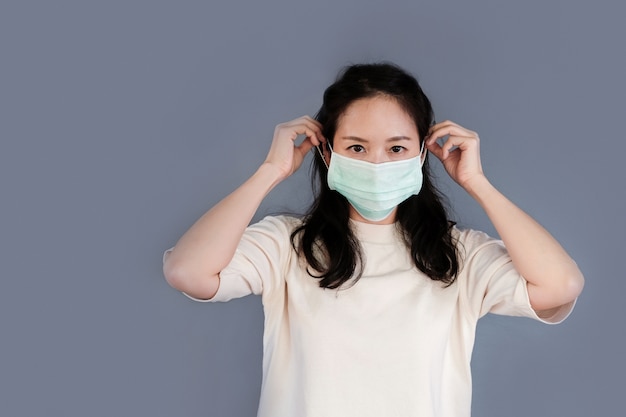 Girl with mask to protect her from virus or pollution