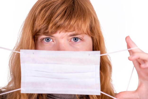 Girl with a medical mask close up