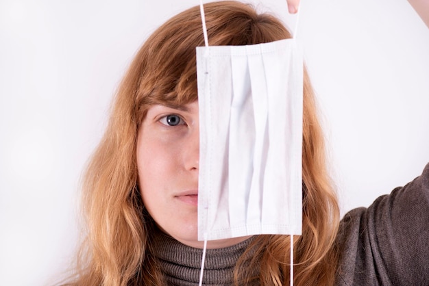 Photo girl with a medical mask close up