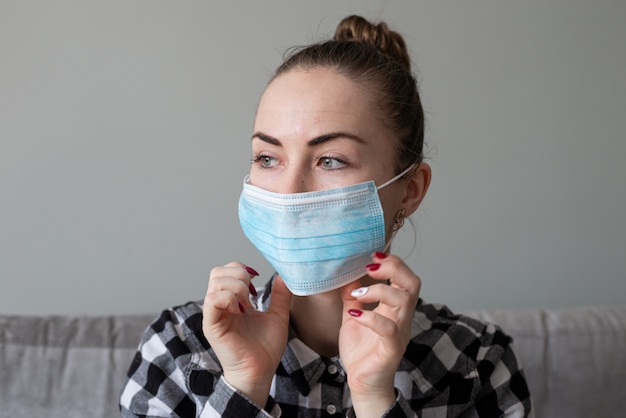 Girl with medical mask to protect her from virus