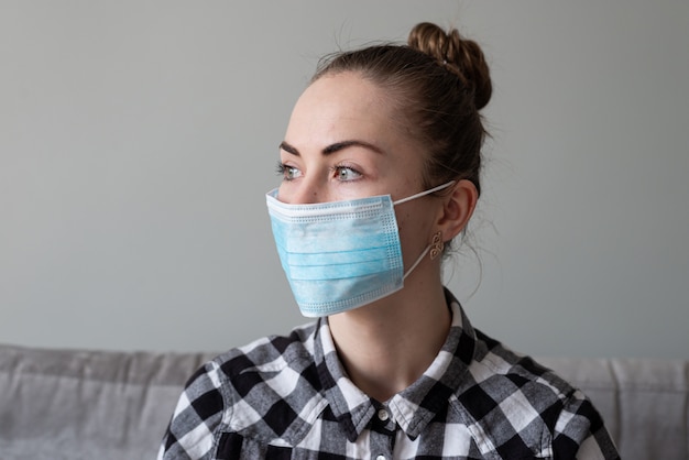 Girl with medical mask to protect her from virus