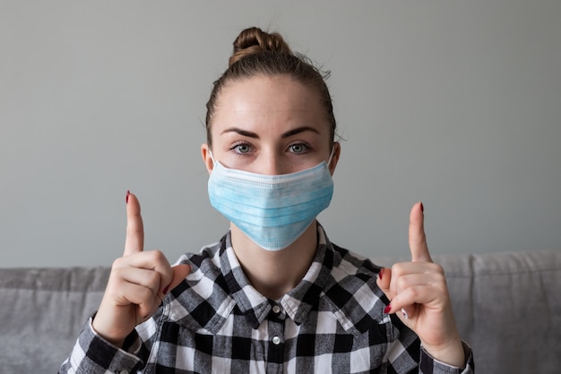 Girl with medical mask to protect her from virus