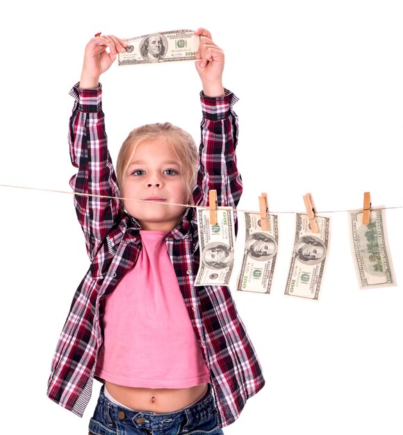 Photo girl with money girl hangs on the money on the rope on a white background