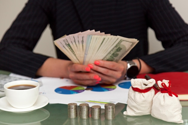 Girl with money at the table