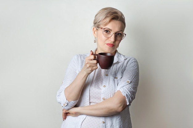 Girl with a mug of coffee in her hands