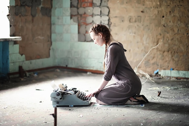 A girl with old books in the old house