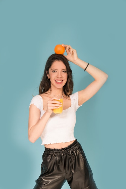 Girl with orange fresh juice 