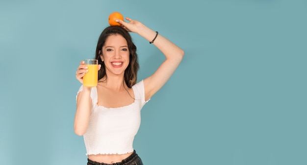 Girl with orange fresh juice 