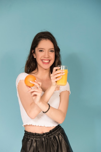 Girl with orange fresh juice 