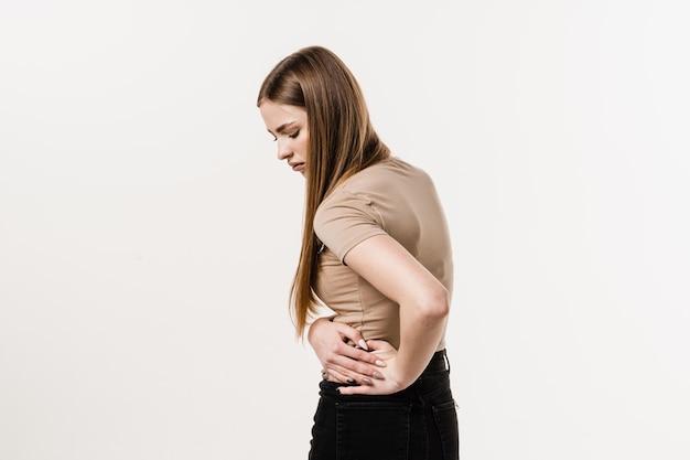 Girl with pelvic inflammatory disease on white background PID infection of one or more of the upper reproductive organs including the uterus fallopian tubes and ovaries