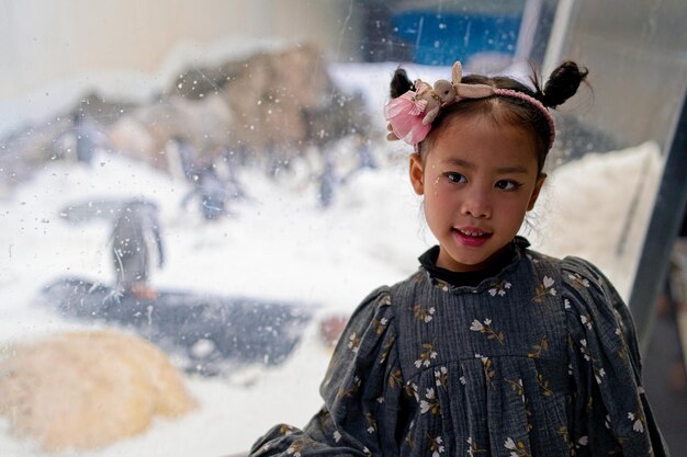 A girl with pigtails and a flower in her hair