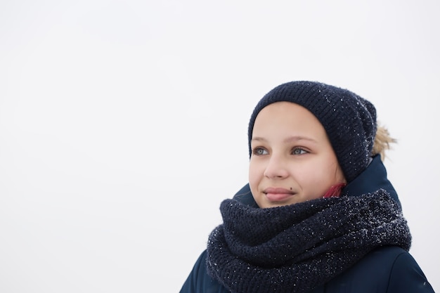 Girl with pink hair wearing a hat