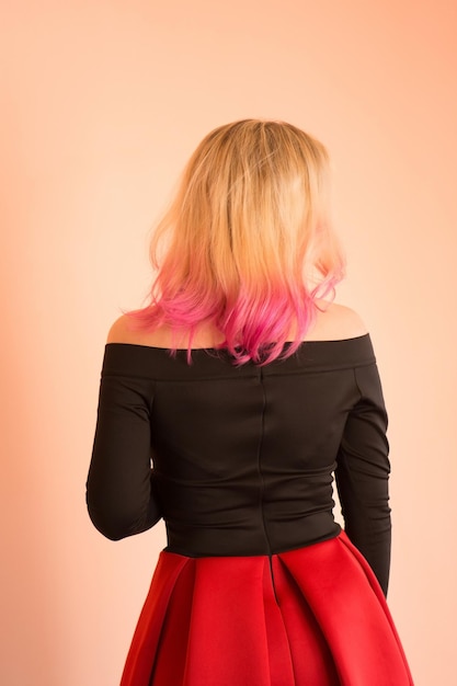 Girl with pink hairstyle in prom dress