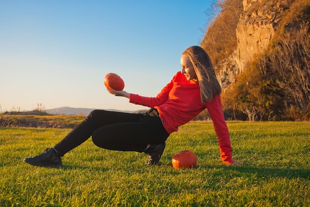 Girl with pumpkins. Autumn. Halloween.