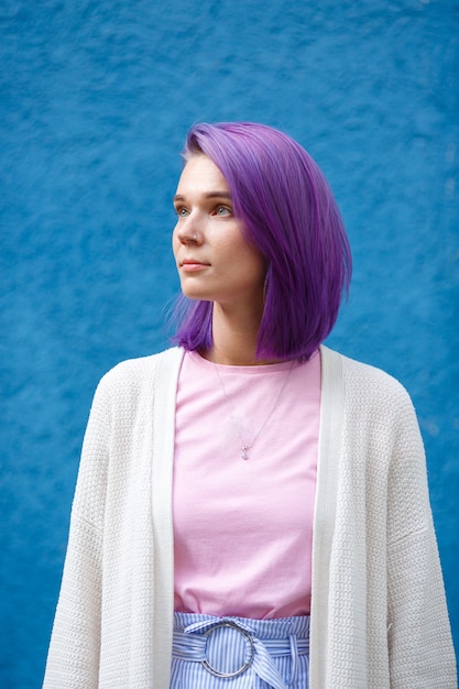 Photo girl with purple hair on blue