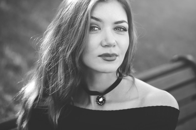 Girl with red hair in a black dress.