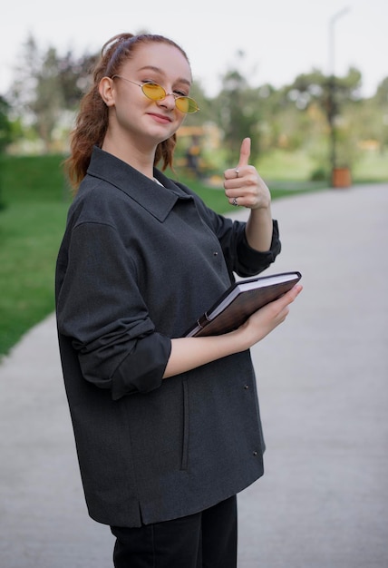 Girl with red hair looking at camera showing super smiling