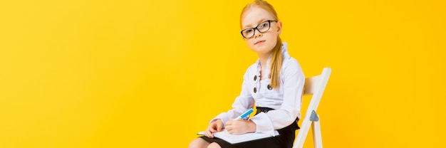 Girl with red hair on a yellow background