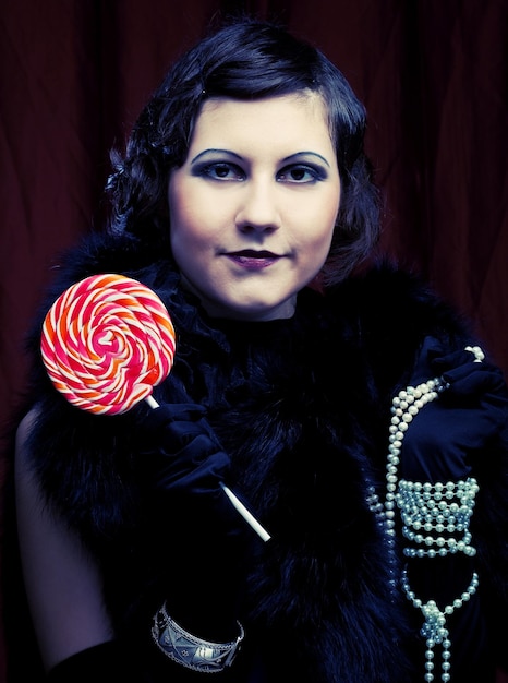 Photo girl with red lollipop