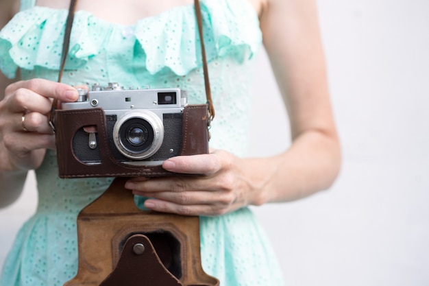 Girl with retro camera. Vintage.