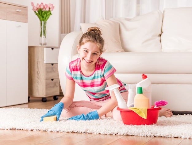 Girl with set of cleaning tools