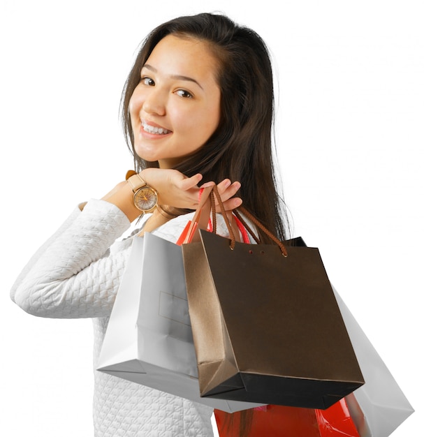 Girl with shopping bags on white