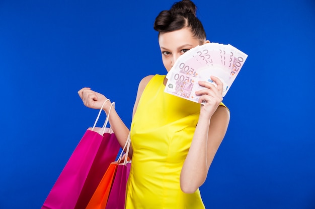 Girl with shopping and money