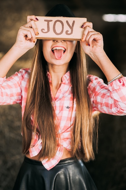 Photo girl with a sign joy