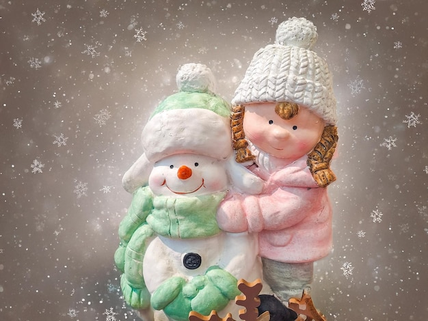 a girl with a snowman layout of new years toys accessories gifts new year