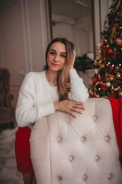 a girl with sofa in the Christmas decorations