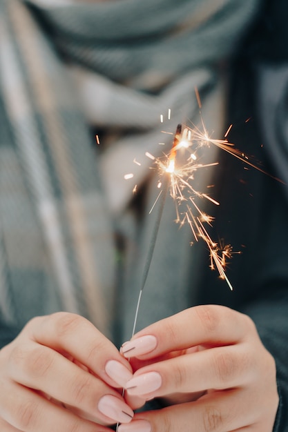 girl with sparkler in hands