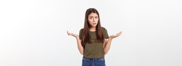 Girl with a suspicious look and hand on her side on a white isolated background