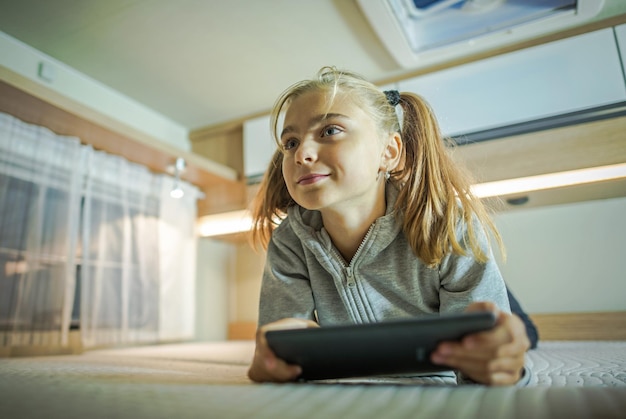 Photo girl with tablet inside rv