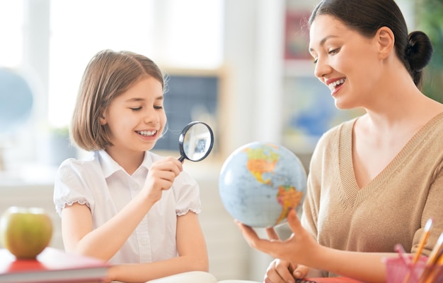 Girl with teacher in classroom