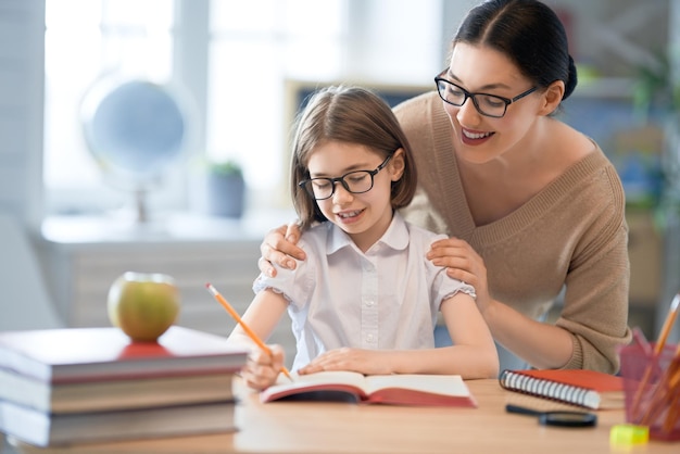 Girl with teacher in classroom